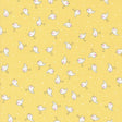 a yellow background with small white birds on it