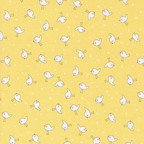a yellow background with small white birds on it