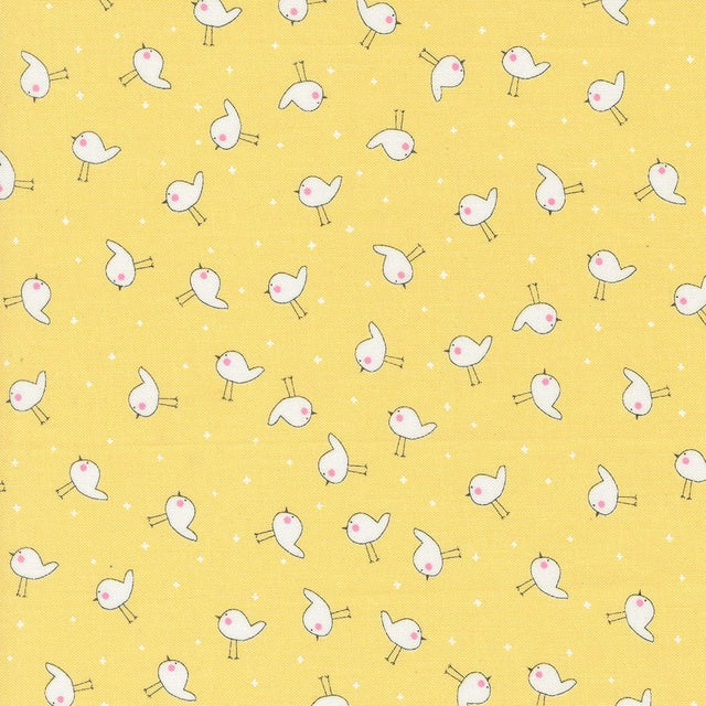 a yellow background with small white birds on it