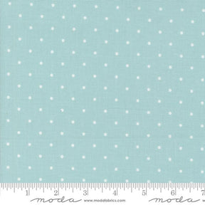a ruler with a blue background with white polka dots