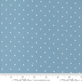 a blue background with white polka dots