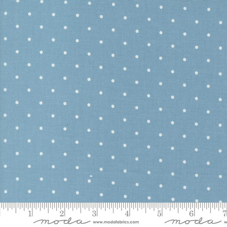 a blue background with white polka dots