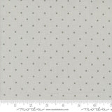 a ruler with a white background with gray polka dots