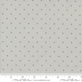 a ruler with a white background with gray polka dots
