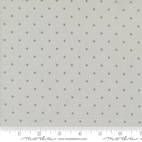 a ruler with a white background with gray polka dots