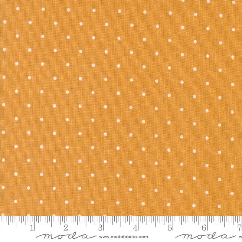 a ruler with a yellow background with white dots