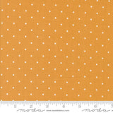 a ruler with a yellow background with white dots