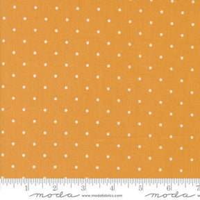 a ruler with a yellow background with white dots