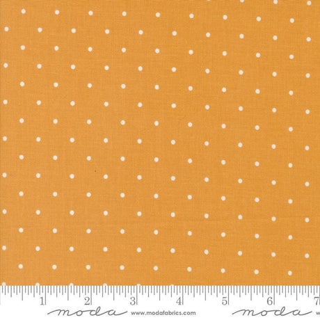 a ruler with a yellow background with white dots