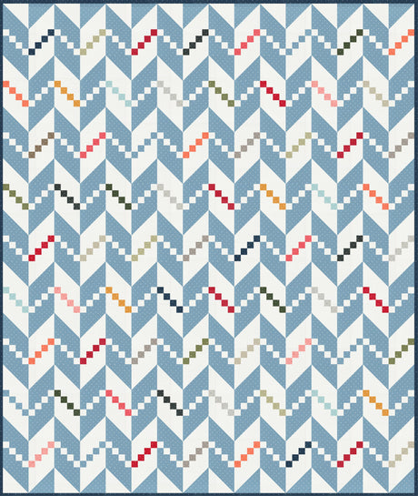 a blue and white quilt with a pattern on it
