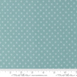a ruler with a blue background with white circles