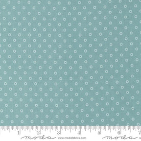 a ruler with a blue background with white circles