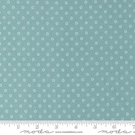 a ruler with a blue background with white circles