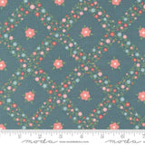 a blue background with pink and blue flowers