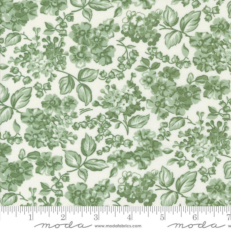 a green and white floral print on a white background