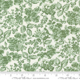 a green and white floral print on a white background