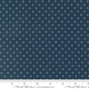 a ruler with a blue background with white circles