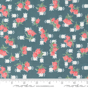 a blue fabric with pink roses on it