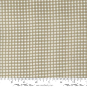 a beige and white checkered fabric with a ruler
