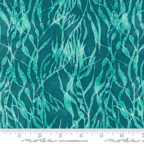 a blue and green fabric with leaves on it