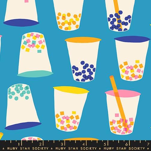 a blue background with cups and a ruler