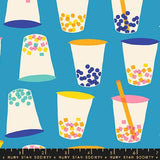 a blue background with cups and a ruler