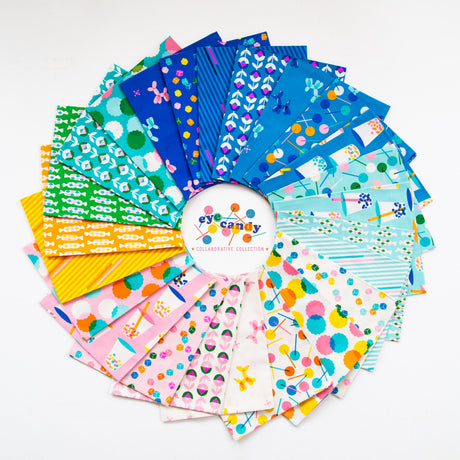 a bunch of different colored papers on a white surface