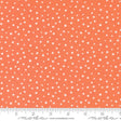 an orange and white polka dot print fabric