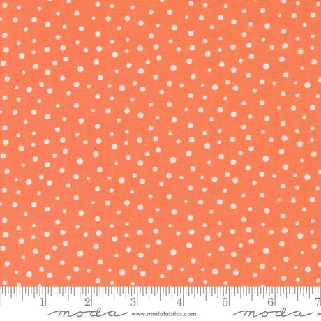 an orange and white polka dot print fabric