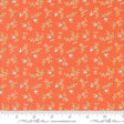 an orange fabric with small flowers on it