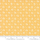 a yellow background with white flowers on it