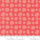 a red background with pink flowers and green leaves