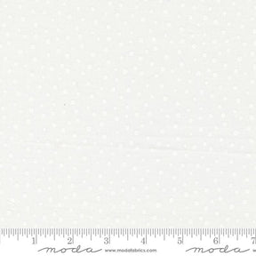 a ruler with a white background with white polka dots