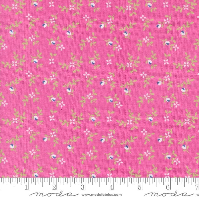 a pink fabric with small flowers on it