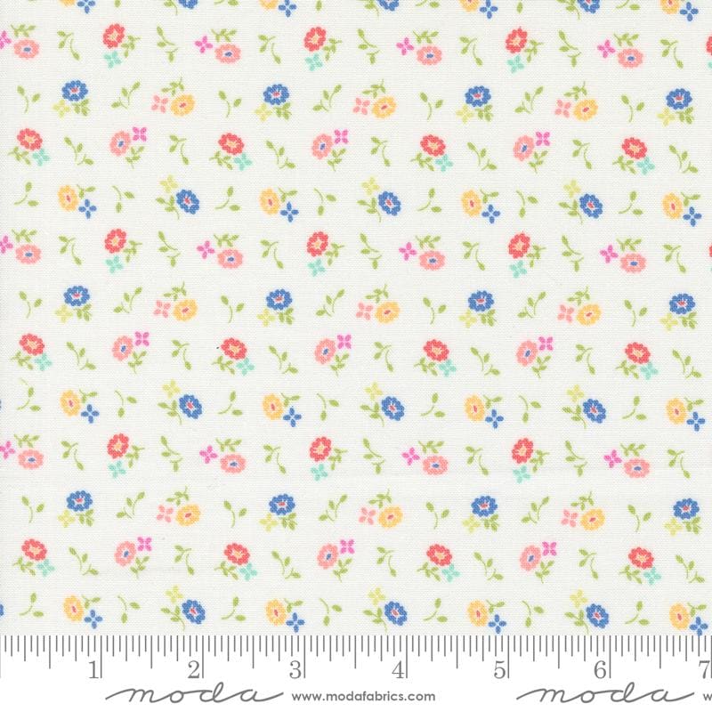 a white fabric with colorful flowers on it