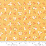 a yellow background with white flowers and green leaves