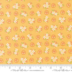 a yellow background with white flowers and green leaves