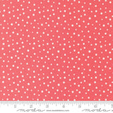 a ruler with a red background with white polka dots