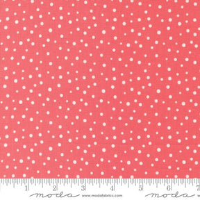 a ruler with a red background with white polka dots