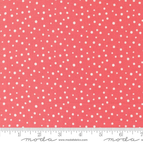 a ruler with a red background with white polka dots