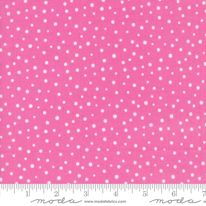 a pink background with white polka dots
