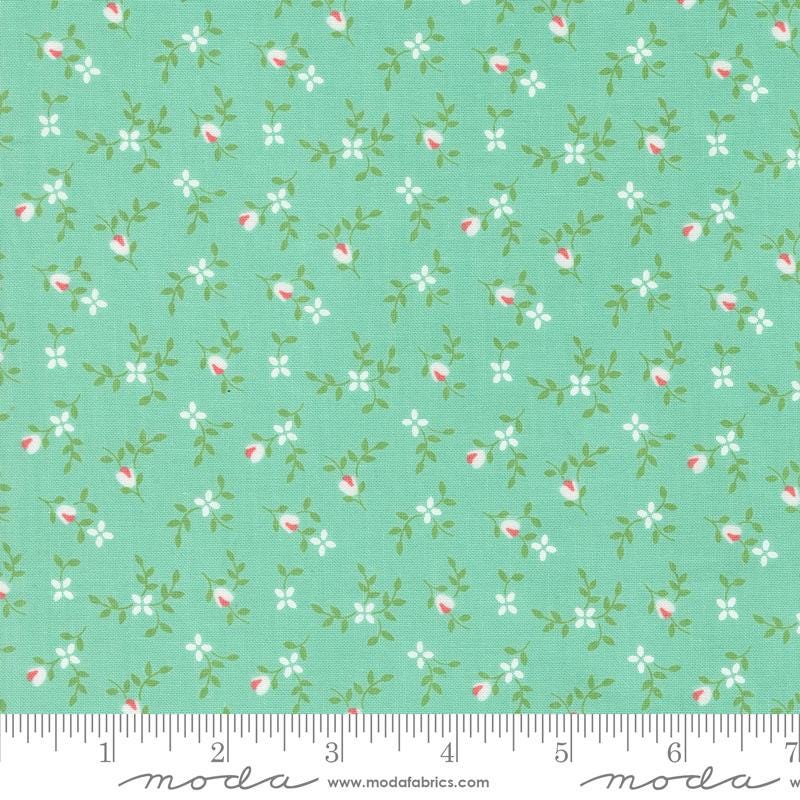 a green background with pink and white flowers