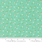 a green background with pink and white flowers