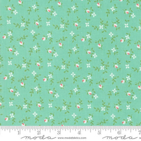 a green background with pink and white flowers
