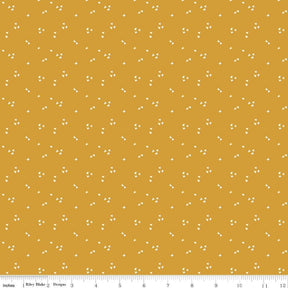 a yellow background with small white dots