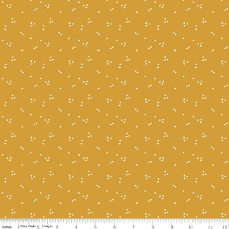 a yellow background with small white dots