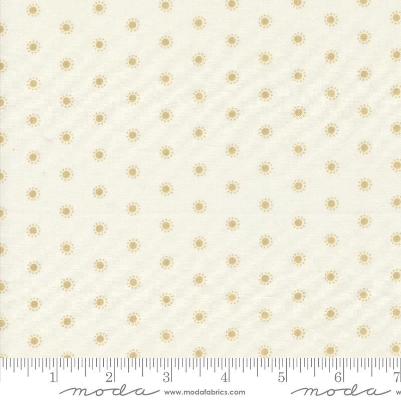 a ruler with a white background with gold dots