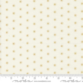 a ruler with a white background with gold dots