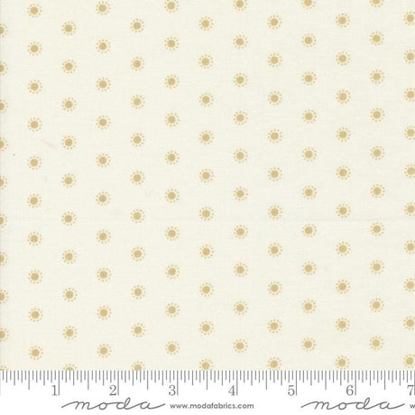 a ruler with a white background with gold dots