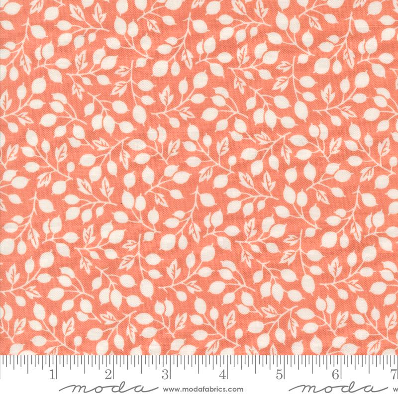 an orange and white fabric with leaves on it
